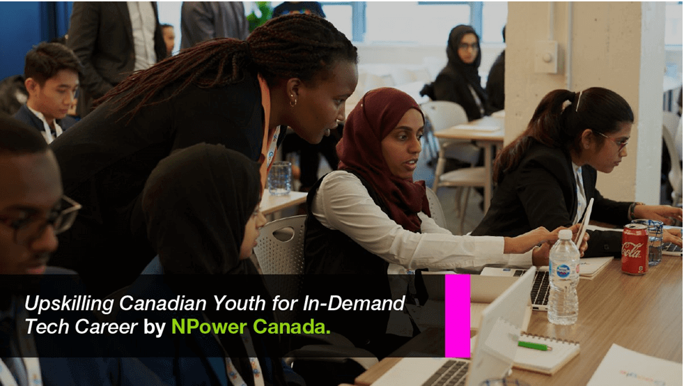 Image of a group of tech students with laptops in a classroom with a student asking a question to a facilitator with black box on top with Upskilling Canadian Youth for In-Demand Tech Career by NPower Canada text in white and green font text