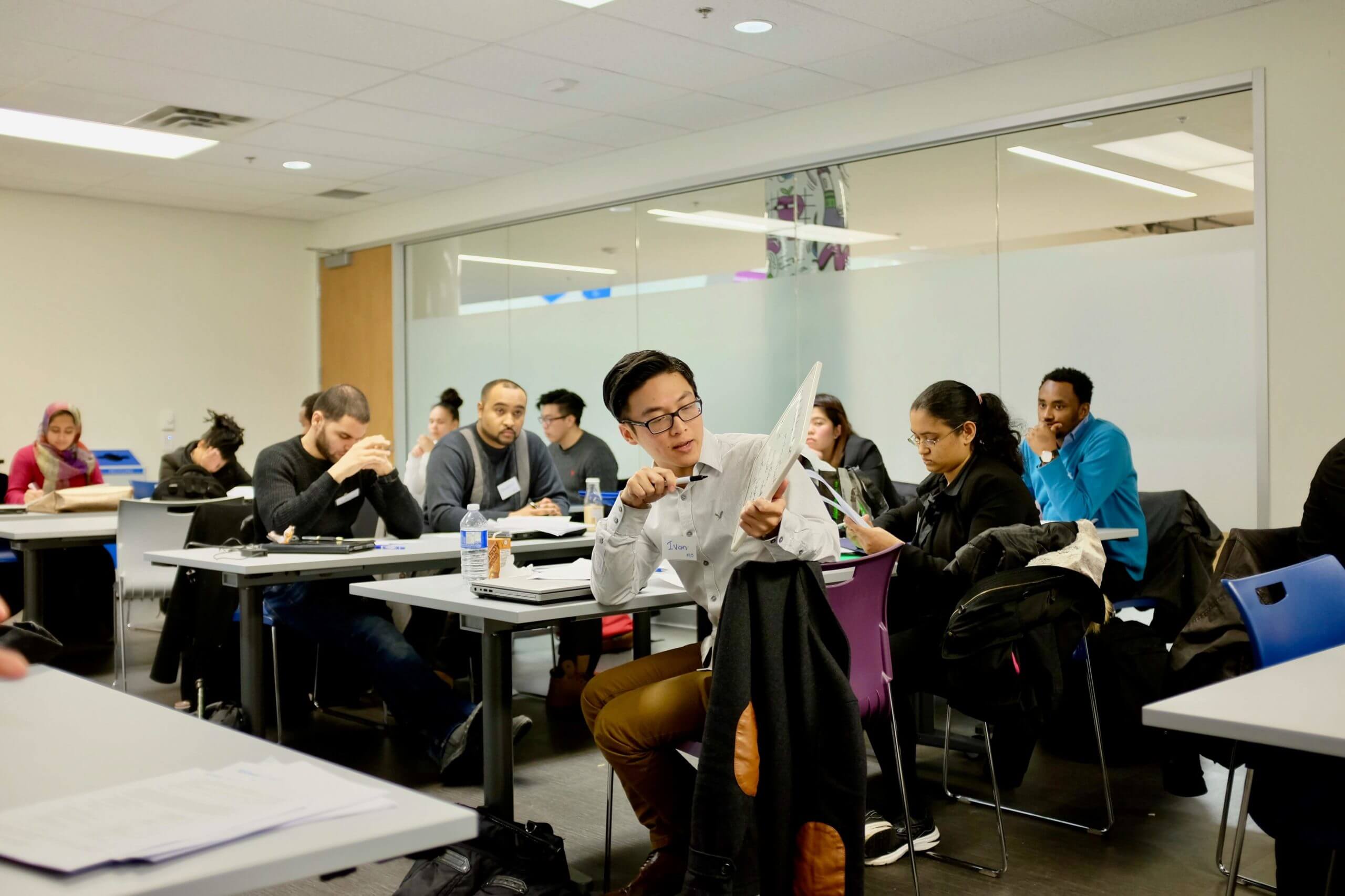 Image of a diverse group of tech students in a classroom